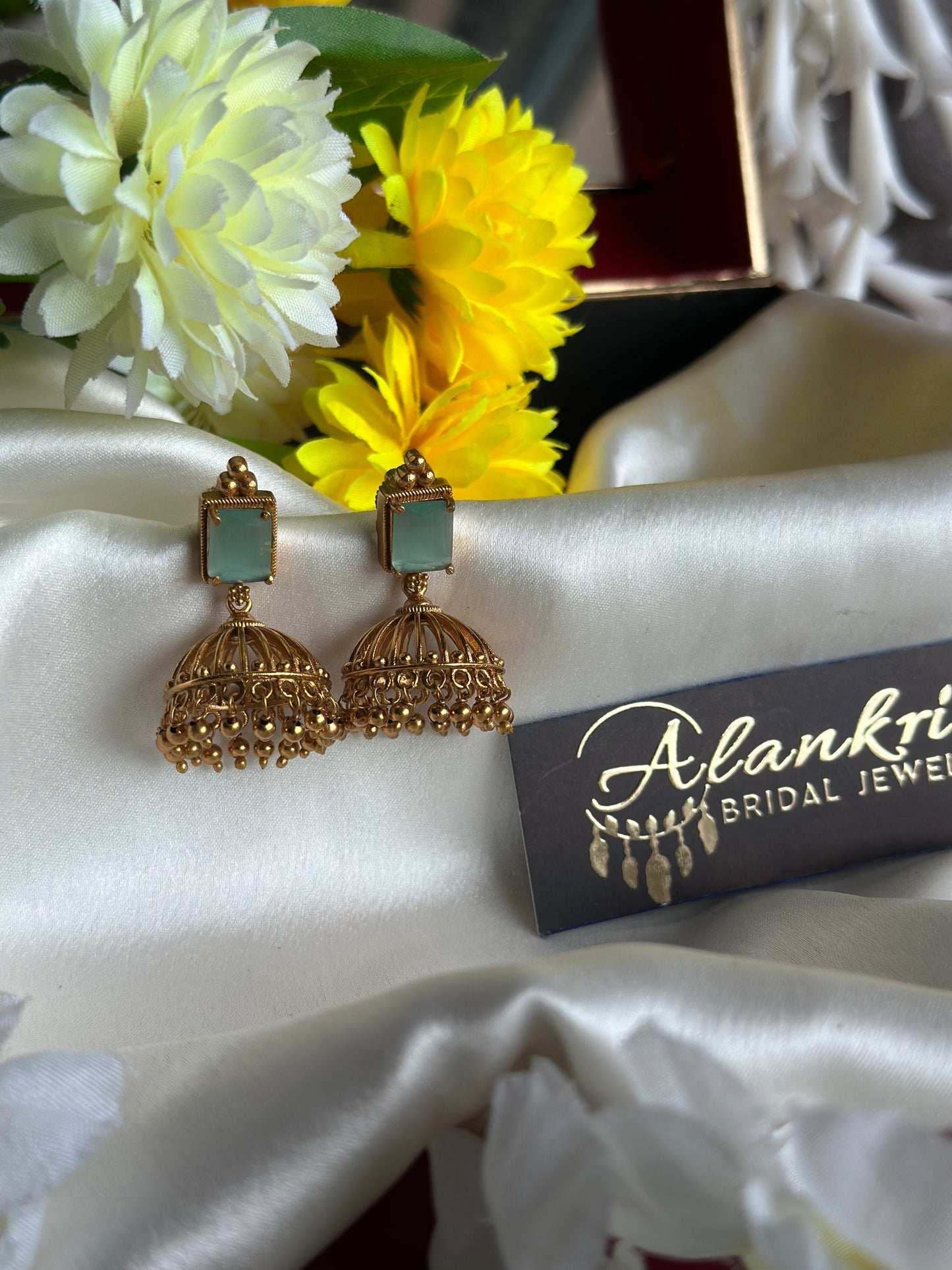 Antique Gold Jhumka with AD Stones